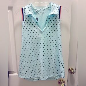 Woman’s under armor, sleeveless golf shirt.